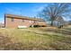 Brick house with a deck and expansive backyard at 2540 Mayo Lake Rd, Roxboro, NC 27574