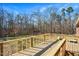 Wooden deck overlooking a wooded backyard at 2540 Mayo Lake Rd, Roxboro, NC 27574