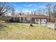Brick ranch home with a spacious yard, detached garage, and a separate shed at 2540 Mayo Lake Rd, Roxboro, NC 27574