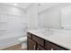 Bathroom featuring a single vanity with quartz countertops and a tub/shower combo at 316 Church St, Morrisville, NC 27560