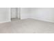 Spacious bedroom featuring neutral carpet and white trim with multiple doorways at 316 Church St, Morrisville, NC 27560