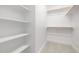 Closet with white shelves and closet rods for storage at 316 Church St, Morrisville, NC 27560