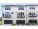 Rear exterior of townhome with black framed windows and balconies at 316 Church St, Morrisville, NC 27560