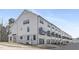 Modern townhome exterior with individual garages and dark-framed windows and small balconies at 316 Church St, Morrisville, NC 27560