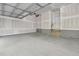 Spacious two-car garage featuring unfinished drywall and ample space for parking and storage at 316 Church St, Morrisville, NC 27560