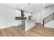 Bright, white kitchen offers a kitchen island and stainless steel appliances at 316 Church St, Morrisville, NC 27560