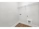 Laundry area including utility hookups, white walls and vinyl flooring at 316 Church St, Morrisville, NC 27560