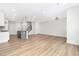 Open-concept living room with hardwood floors adjacent to a modern kitchen at 316 Church St, Morrisville, NC 27560