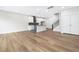 Open-concept living room with hardwood floors adjacent to a modern kitchen at 316 Church St, Morrisville, NC 27560