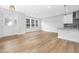 Sun-filled living room with wood floors, adjacent to the kitchen at 316 Church St, Morrisville, NC 27560