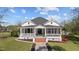 Beautiful home featuring a well-manicured lawn and a charming porch, creating excellent curb appeal at 400 S Boddie St, Nashville, NC 27856