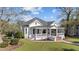 Lovely home with manicured lawn, inviting front porch, and mature landscaping at 400 S Boddie St, Nashville, NC 27856