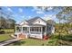 Charming home with inviting front porch, lush lawn, and mature trees at 400 S Boddie St, Nashville, NC 27856