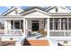 Inviting front porch with patriotic decor, classic columns, and a relaxing ambiance at 400 S Boddie St, Nashville, NC 27856