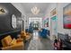 Stylish hallway with elegant chandelier, colorful accents, and open doorways at 400 S Boddie St, Nashville, NC 27856