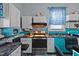 Charming kitchen with updated appliances, counter space and custom blue and white cabinets at 400 S Boddie St, Nashville, NC 27856