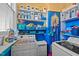 Functional laundry room with ample shelving, storage, and modern appliances at 400 S Boddie St, Nashville, NC 27856
