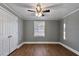Simple bedroom with hardwood floors, a window, and neutral walls at 408 W Main St, Pine Level, NC 27568
