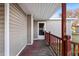 Back deck with a wooden railing and access to backyard at 408 W Main St, Pine Level, NC 27568