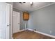 Laundry room with wood cabinets, vinyl flooring and neutral walls at 408 W Main St, Pine Level, NC 27568