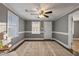 Inviting living room featuring neutral walls, classic trim, and natural light from two large windows at 408 W Main St, Pine Level, NC 27568