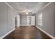 Spacious living room with hardwood floors and neutral walls at 408 W Main St, Pine Level, NC 27568