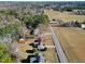 Expansive aerial view showcasing the property's mature trees and convenient road access at 5317 Ten Ten Rd, Apex, NC 27539