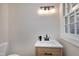 Modern bathroom with a vanity and window at 5317 Ten Ten Rd, Apex, NC 27539