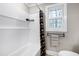 Clean bathroom features a shower/tub combo and updated fixtures at 5317 Ten Ten Rd, Apex, NC 27539
