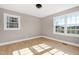 Well-lit bedroom featuring two large windows at 5317 Ten Ten Rd, Apex, NC 27539