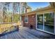 Wooden deck overlooks backyard with mature trees at 5317 Ten Ten Rd, Apex, NC 27539