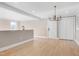 Spacious dining room with hardwood floors and access to kitchen at 5317 Ten Ten Rd, Apex, NC 27539