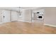 Dining room with hardwood floors, chandelier, and access to living room at 5317 Ten Ten Rd, Apex, NC 27539