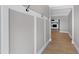 Bright entryway with coat hooks and view to living room at 5317 Ten Ten Rd, Apex, NC 27539