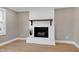 White brick fireplace with wood mantel in living room at 5317 Ten Ten Rd, Apex, NC 27539