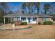 Charming single-story home with brick accents, blue shutters and a well-maintained front yard at 5317 Ten Ten Rd, Apex, NC 27539
