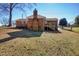 Brick ranch house with backyard and steps at 5317 Ten Ten Rd, Apex, NC 27539