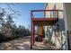 Backyard featuring a wooden deck with red stairs and a patio area at 664 Long Melford Dr, Rolesville, NC 27571