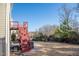 Backyard featuring a wooden staircase, green bushes and a black metal fence at 664 Long Melford Dr, Rolesville, NC 27571