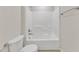 Bright white bathroom with a bathtub and tile surround at 664 Long Melford Dr, Rolesville, NC 27571
