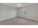 Neutral bedroom with window allowing natural light; carpeted at 664 Long Melford Dr, Rolesville, NC 27571