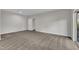 Spacious bedroom featuring neutral carpet, light-colored walls and a sliding glass door at 664 Long Melford Dr, Rolesville, NC 27571