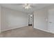 This bedroom features neutral walls, carpet, and a ceiling fan for added comfort at 664 Long Melford Dr, Rolesville, NC 27571