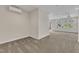 Spacious bonus room with neutral carpet, light-colored walls and a backyard view at 664 Long Melford Dr, Rolesville, NC 27571