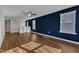 Open bonus room features hardwood flooring, a ceiling fan, and plenty of natural light at 664 Long Melford Dr, Rolesville, NC 27571
