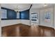 Spacious dining room features hardwood floors, elegant chandelier, and wainscoting details at 664 Long Melford Dr, Rolesville, NC 27571