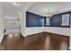 Dining room with dark accent wall, wainscoting and traditional chandelier at 664 Long Melford Dr, Rolesville, NC 27571