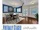 Dining area with stylish decor including rug, table, chairs, wall art and plants at 664 Long Melford Dr, Rolesville, NC 27571