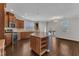 Kitchen boasts granite counters and backsplash, stainless steel appliances, and wood floors at 664 Long Melford Dr, Rolesville, NC 27571
