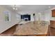 Kitchen has granite counters and opens to the living room with fireplace at 664 Long Melford Dr, Rolesville, NC 27571